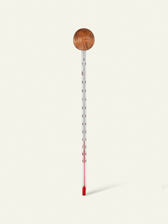 Analoges Thermometer Bild von einem Holzthermometer, Haarpflege-Ausrüstung von Khadi